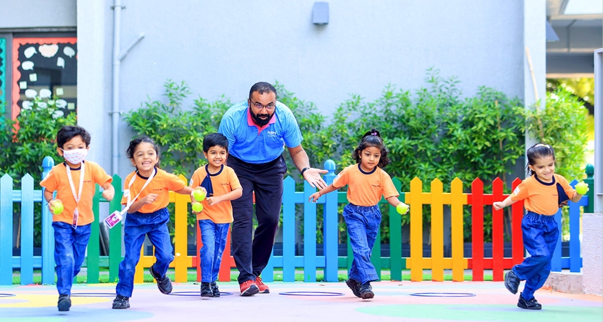 students playing in playground at Adani international School