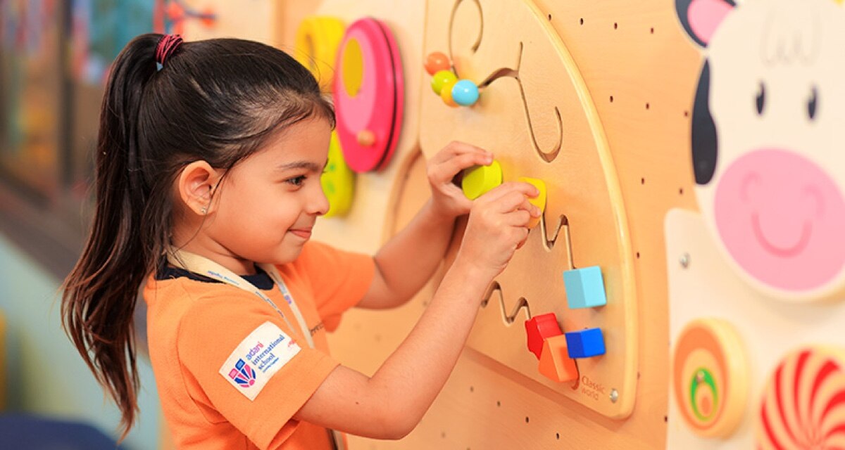 girl student playing  at Adani International School
