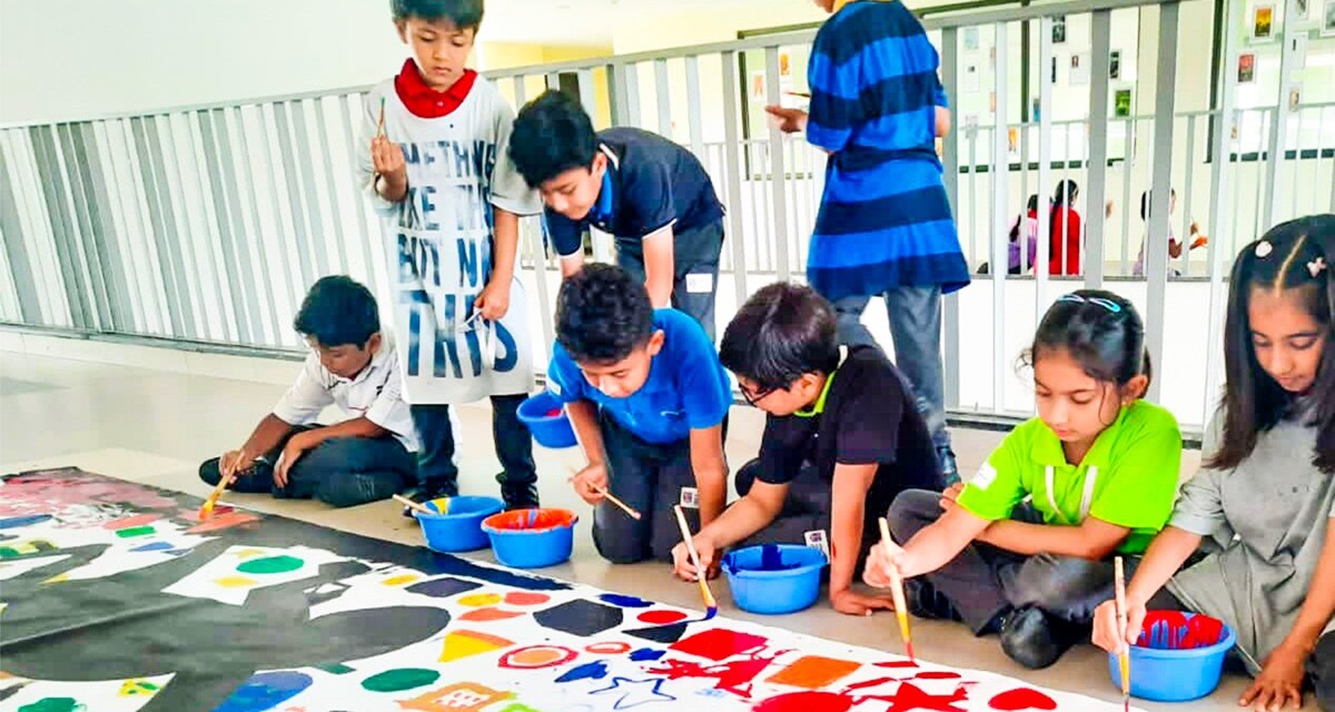 students doing painting at Adani international School