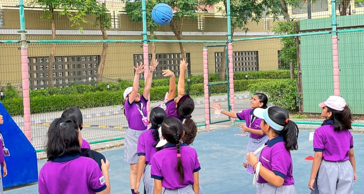 girl students playing bolly-ball at Adani International School