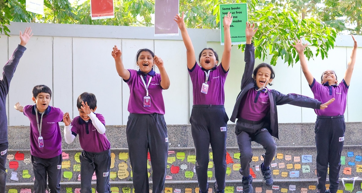 students in amphitheatre at Adani international School