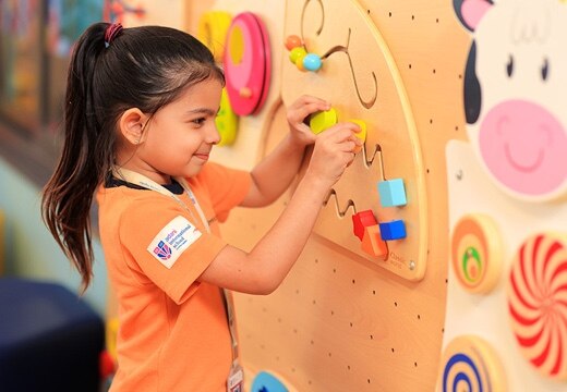 girl student playing at Adani International School