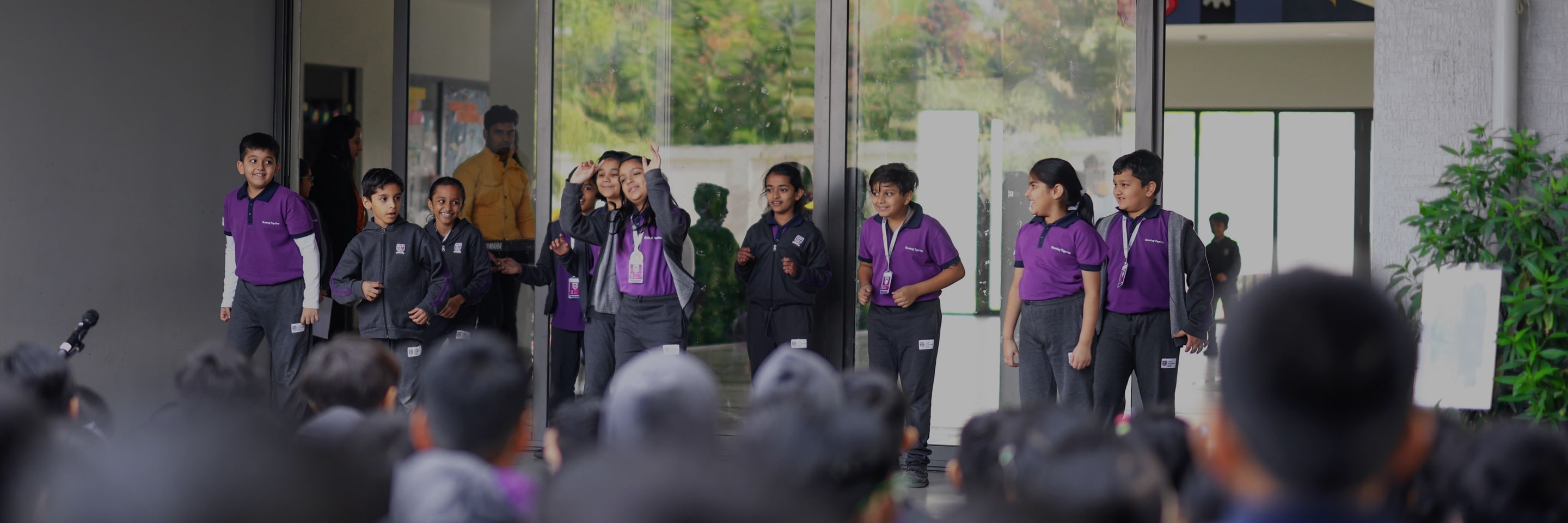 Students standing at the stage at Adani international School