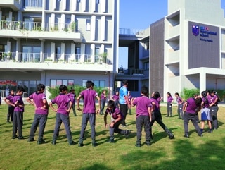 students playing in a ground at Adani international School