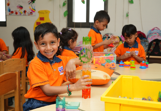 student doing craft activity in a classroom