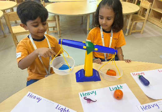 a teacher with student at Adani International School