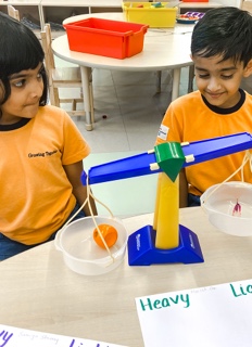 students with weight scale at Adani International School