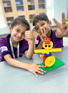 two students with DIY kit