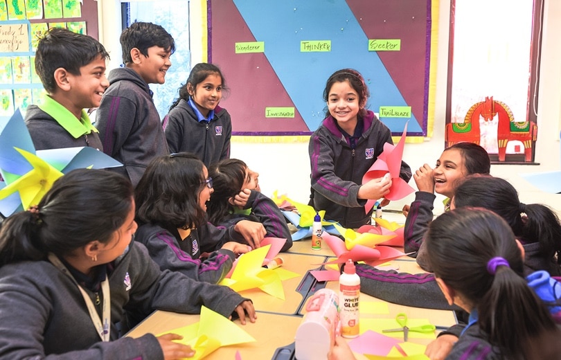 students doing craft activity in a art room