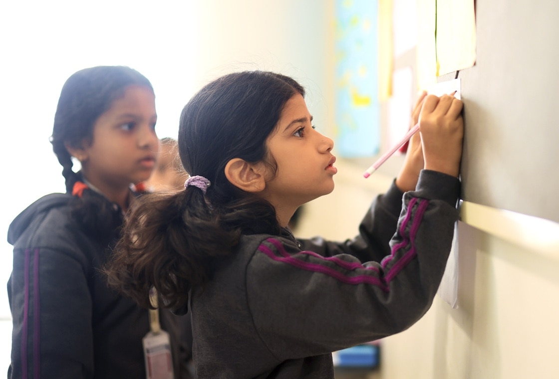 students performing creative writing activity at Adani international School