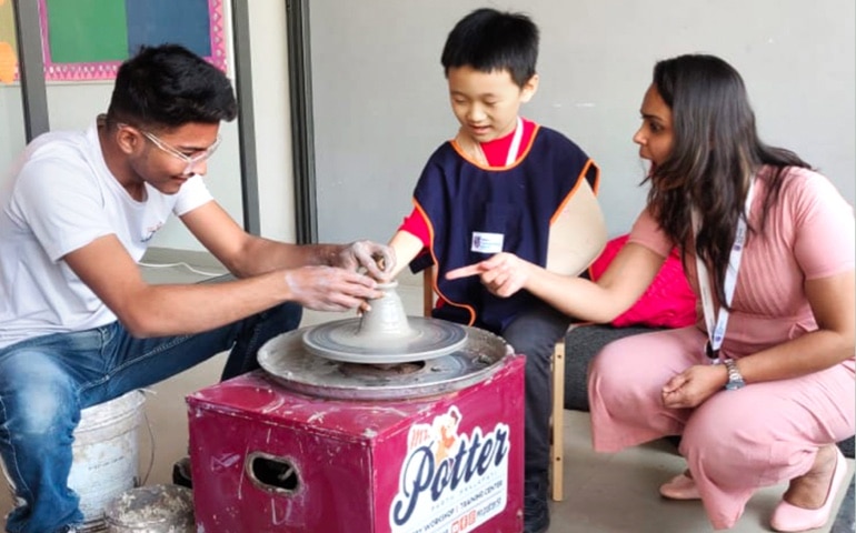 students learning clay modelling at Adani international School