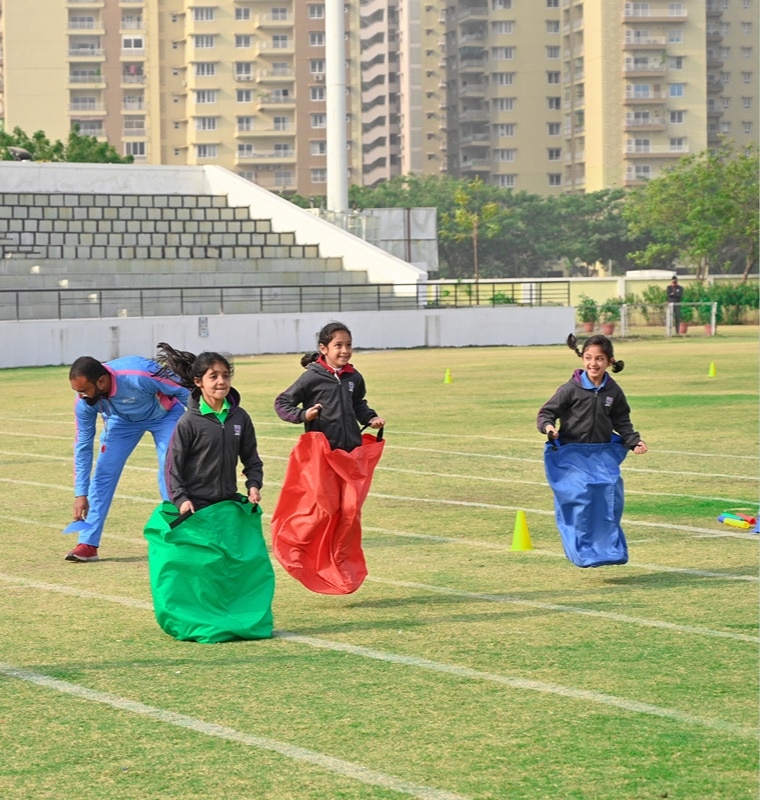 students participating in games at Adani international School