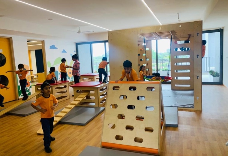 students in gym play area at Adani international School