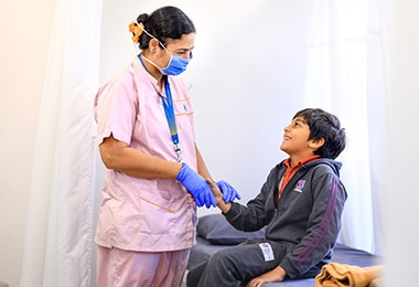 doctor checking the health of a student at Adani International School