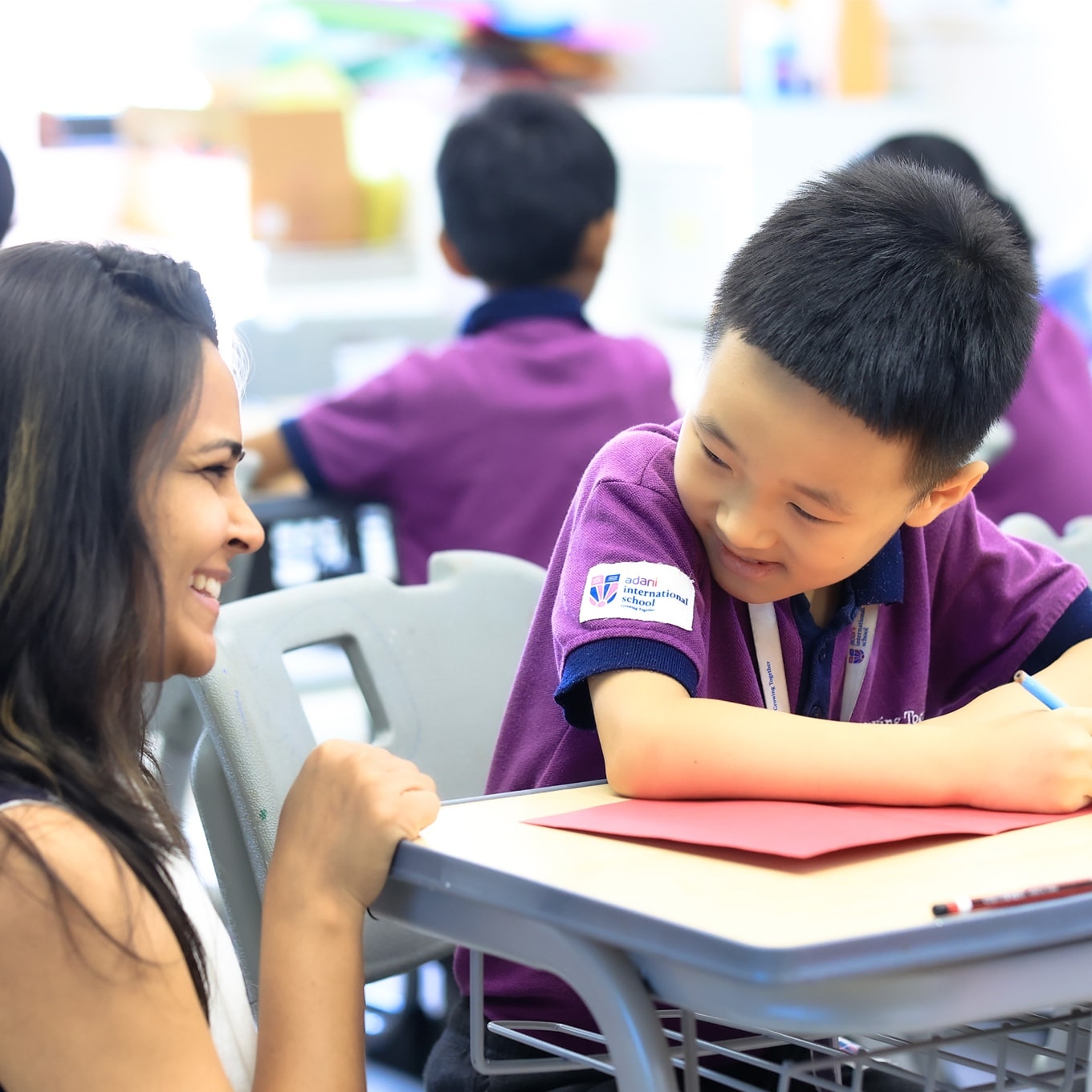 student with teacher at Adani international School