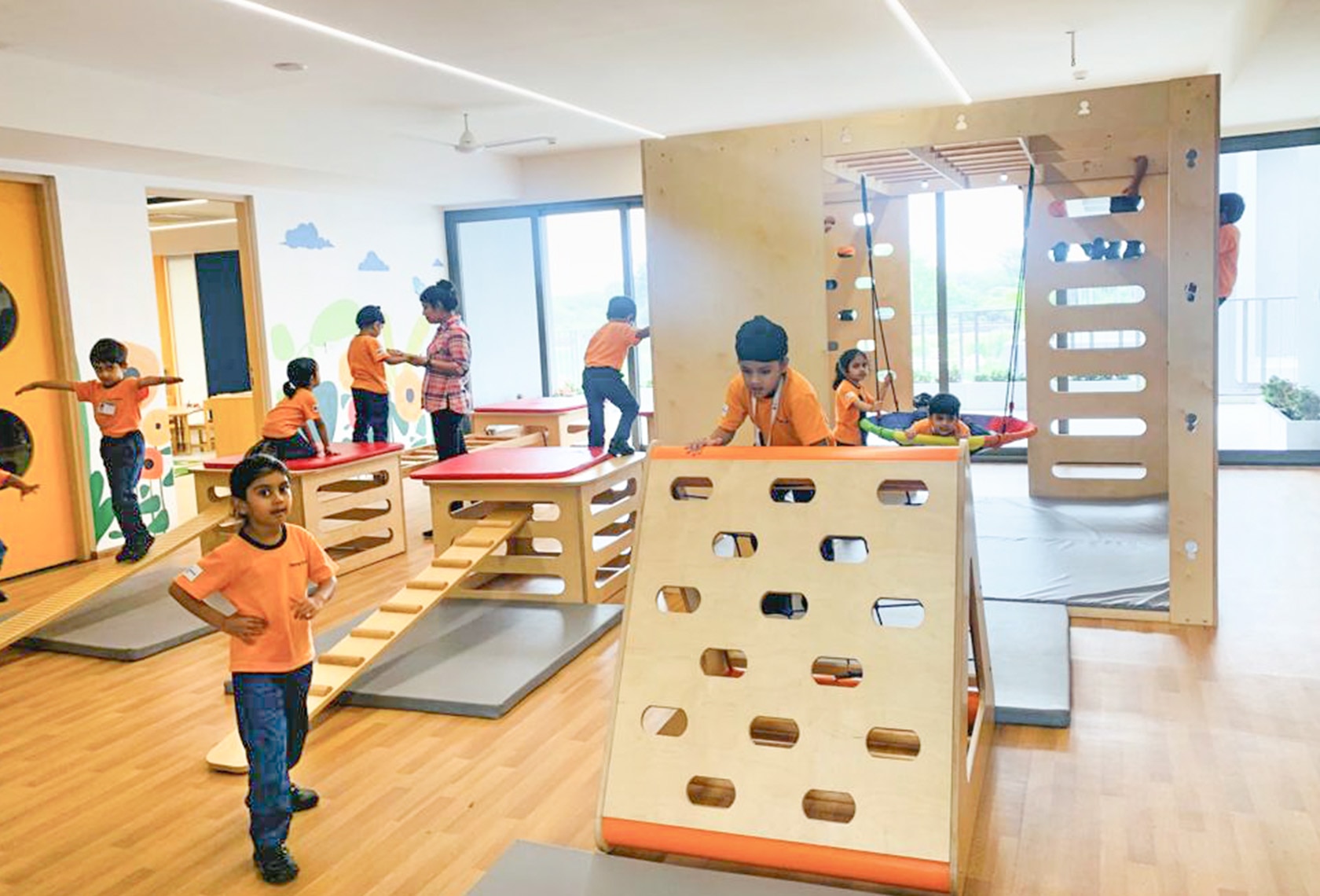 students in gym play area at Adani international School