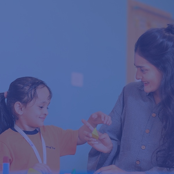 a teacher teaching the student at Adani International school