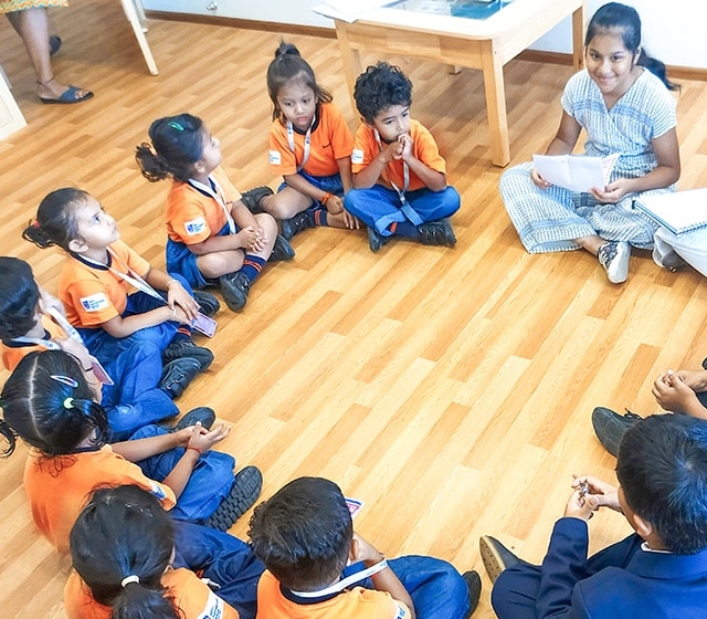 a group of students participating in group discussion at Adani international School