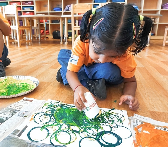 student performing creative art at Adani international School