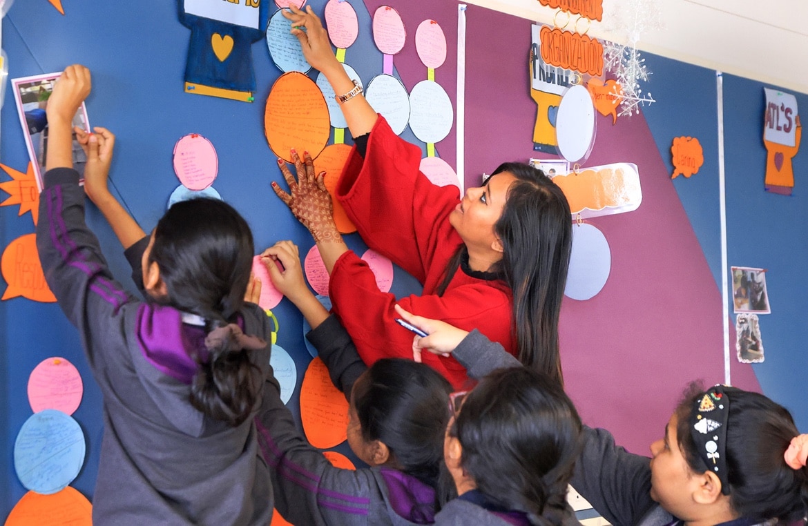 teacher & students decorating display board