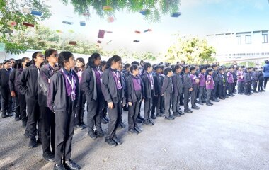 students standing in assembly at Adani International School