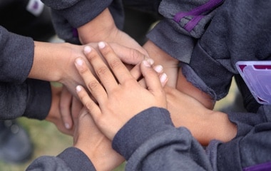 students standing in assembly at Adani International School